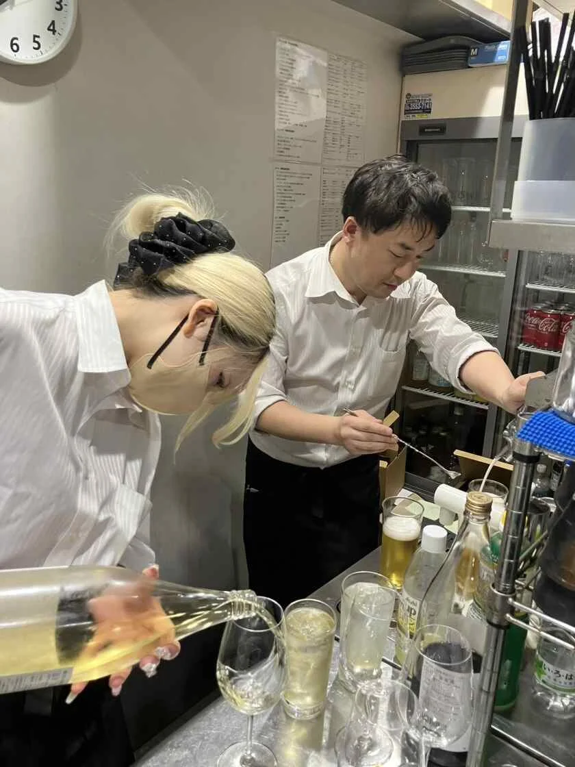 Front-of-house staff preparing drinks